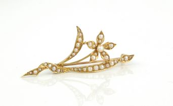 An 18ct yellow gold and seed pearl floral brooch - unmarked, tests as 18ct gold, 49mm long, one