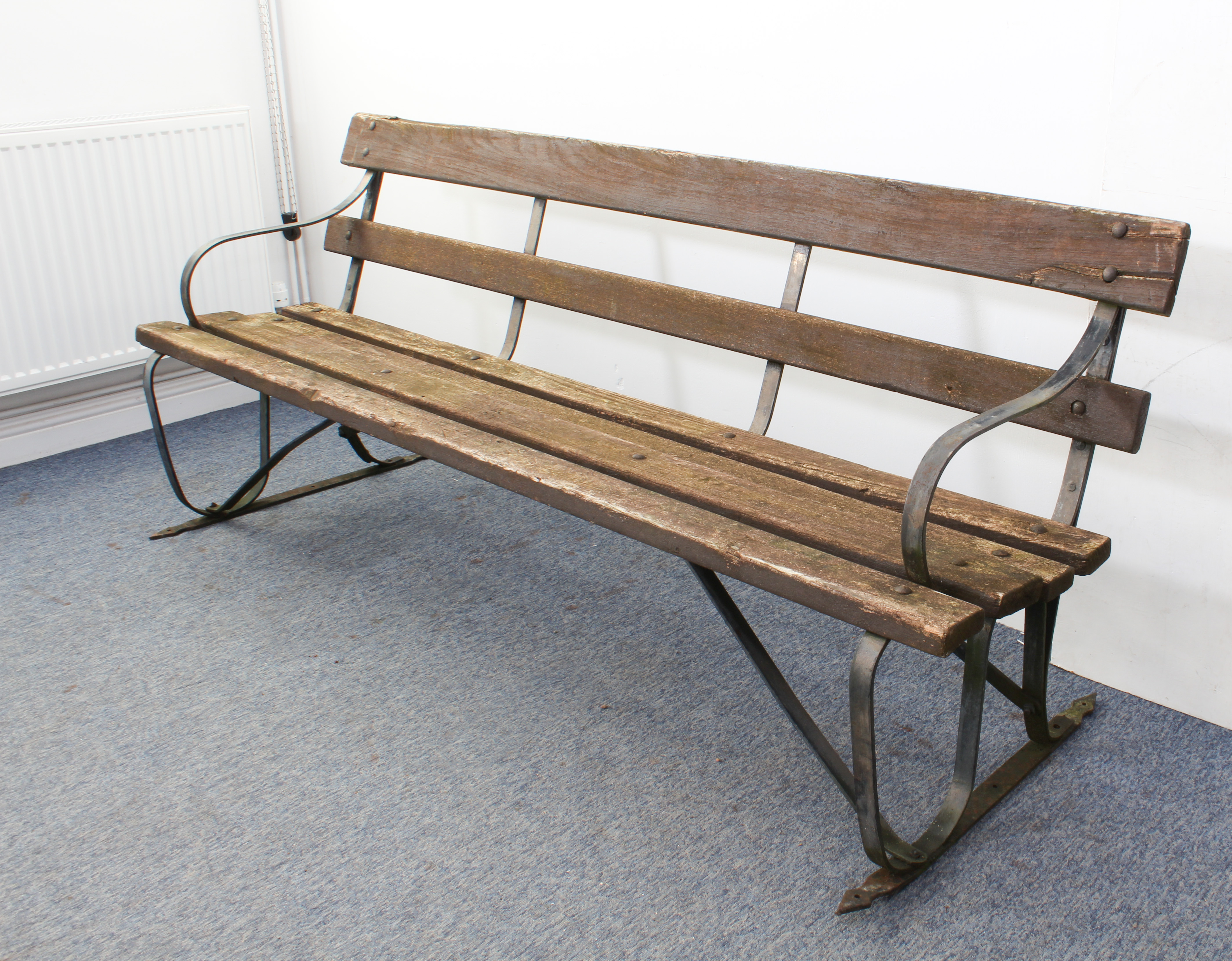 A wrought iron and hardwood slatted garden bench - 198 cm long. (similar to lot 549) - Image 2 of 3