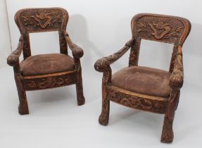 A pair of Anglo-Chinese carved hardwood spoon back armchairs - c.1900, the balloon backs with open