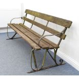A wrought iron and hardwood slatted garden bench - 198 cm long. (similar to lot 548)