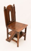 A Victorian reformed Gothic oak metamorphic library steps chair - the pierced, arched panelled