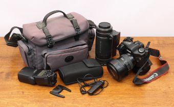 A Canon EOS 5D DSLR camera kit - the 5D camera body with BG-E4 Battery Grip, Canon Ultrasonic EF
