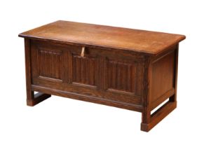 An early 18th century style carved oak small coffer - 1920s-30s, the cleated, boarded top
