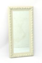 An antique style off-white painted dressing mirror - rectangular, with floral moulded frame and