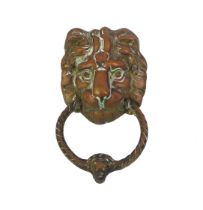 A Georgian style brass lion mask and loose ring door knocker - 19.5 x 11 cm.