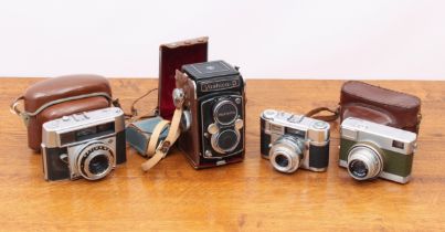 A collection of 1940s-60s cameras - mostly 35mm, including an AGFA Optima III S; a Yashica D twin-