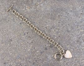 A heavy silver cable link bracelet - stamped '925', with bar and loop clasp and heart-shaped