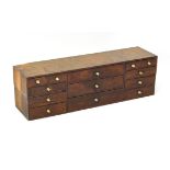 A late 19th / early 20th century oak workman's tool chest - rectangular form, with a bank of three