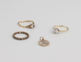 Three 9ct gold rings - two set with a single clear stone (one a/f, stones worn to both), the other