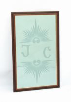 A wooden framed mirror with etched, bevelled plate - etched with the initials 'JC' between