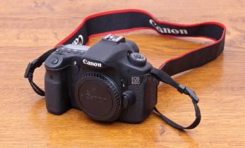 A Canon EOS 60D 18.0 MP Digital SLR camera body - without lens, with battery charger, one battery