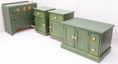 A pair of green painted pine bedside cabinets - each with a single drawer over a panelled cupboard