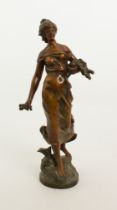 A bronze patinated spelter figure of a maiden, after Auguste Moreau - early 20th century, carrying a