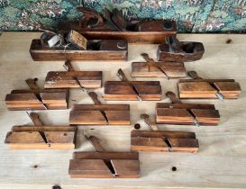 A collection of antique beech woodworking / carpenter's planes - comprising two large bench