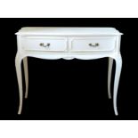 A white painted two drawer serpentine dressing table in the Louis XV taste - 1950s-60s, the