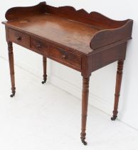 A late-Regency mahogany wash-stand - the shaped three-quarter gallery top over three frieze drawers,