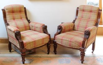 A pair of unusual mid-19th century carved walnut showframe armchairs, probably Irish - the moulded