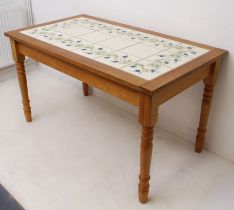 A tile-topped light-oak kitchen or breakfast table - modern, the rectangular, cleated top with