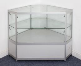 An illuminated glazed aluminium corner display cabinet - of six sided form, with keys. (LWH 119 x