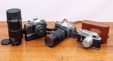 A small collection of 35mm SLR film cameras and lenses - including a Minolta XG-1 with MD f/2 50mm