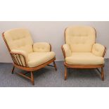 A pair of Ercol Windsor beech and elm Jubilee easy armchairs - with original pale gold upholstered