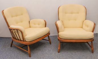 A pair of Ercol Windsor beech and elm Jubilee easy armchairs - with original pale gold upholstered