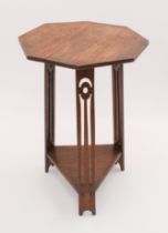 An oak Arts & Crafts style occasional table - early 20th century, the octagonal top raised on three,