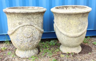 A large pair of weathered composite stone garden urns, 86 cm high, 73 cm rim diameter