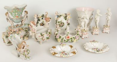 A large group of pottery and porcelain ornaments decorated with cherubs and putto - late 20th