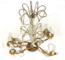 A vintage cut glass and gilt brass six light chandelier (some lustres detached)