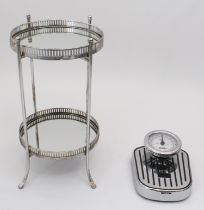 A two-tier mirrored tray table - the two removable mirrored, circular trays with pierced