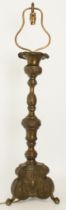 A pressed brass candlestick lamp in Italian 18th century style - with bronze patinated finish,