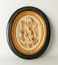 A plaster-style oval relief plaque in the 19th century style - probably Italian, within an