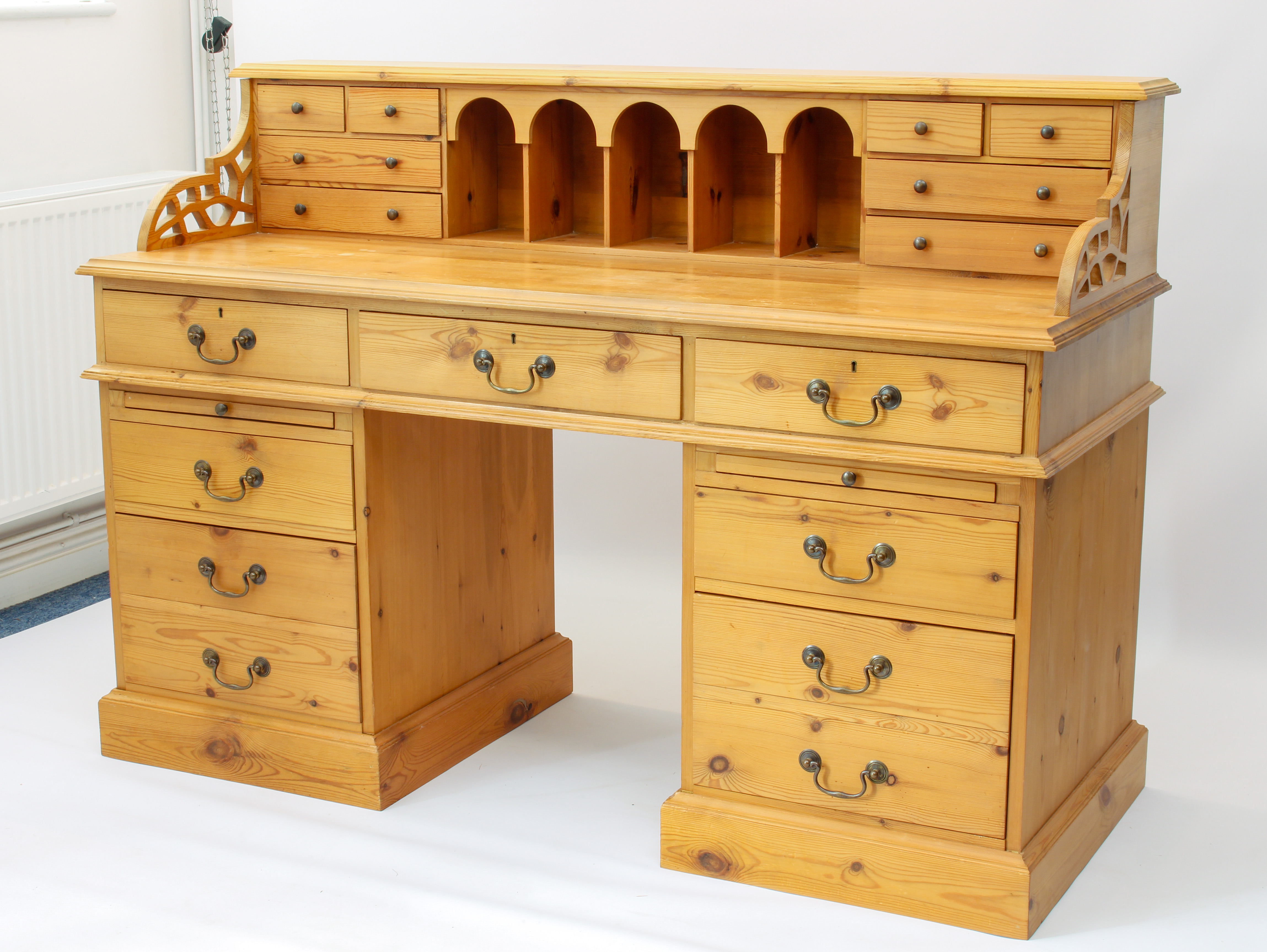A large pine double pedestal desk - the raised gallery back with five arched pigeonholes flanked - Image 2 of 3