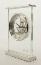 A boxed Acctim Cranfield Quartz skeleton mantel clock - with clear glass and polished alloy case,