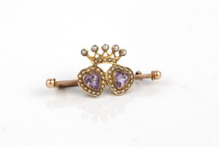 An Edwardian 9ct yellow and rose gold, amethyst and seed pearl bar brooch - stamped '9CT',