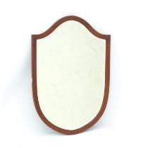 An Edwardian mahogany shield-shaped mirror - with boxwood-strung frame and bevelled plate, 77.5 x