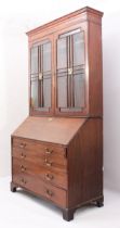 A George III mahogany secretaire bookcase of imposing proportions, probably Scottish - the cavetto