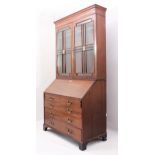 A George III mahogany secretaire bookcase of imposing proportions, probably Scottish - the cavetto