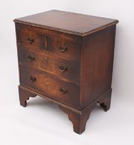 A small reproduction cross banded mahogany chest of drawers - third quarter 20th century, the