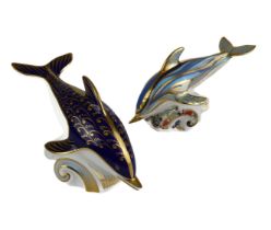 Two Royal Crown Derby Dolphin paperweights - one in blue stripes with gold stopper, first quality,