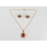 A 22ct gold, red stone and diamond cluster pendant necklace and earrings en suite - unmarked,