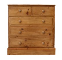 A 19th century style pine chest of drawers - modern, the moulded top over two short and three long