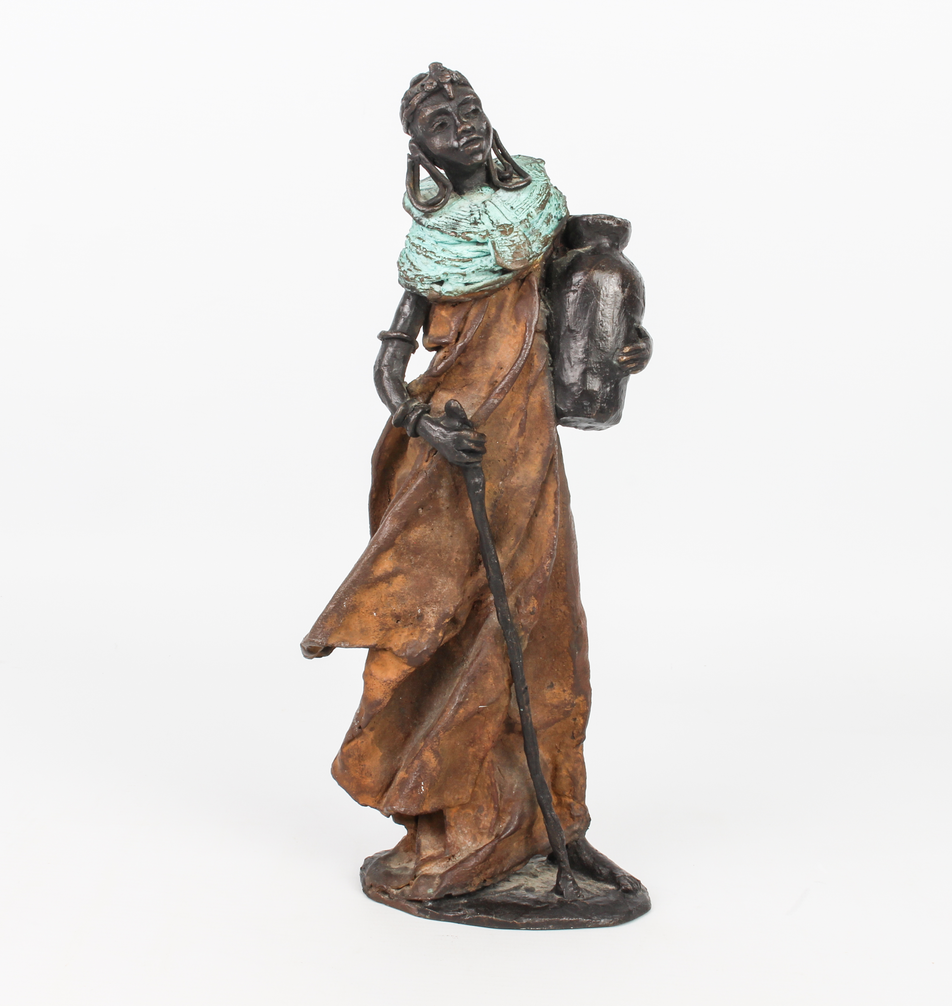 An African patinated bronze figure - modern, the heavily cast figure depicting a female figure