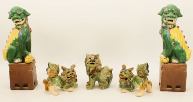 A pair of Chinese porcelain temple dogs - late 20th century, glazed in green and yellow with blue