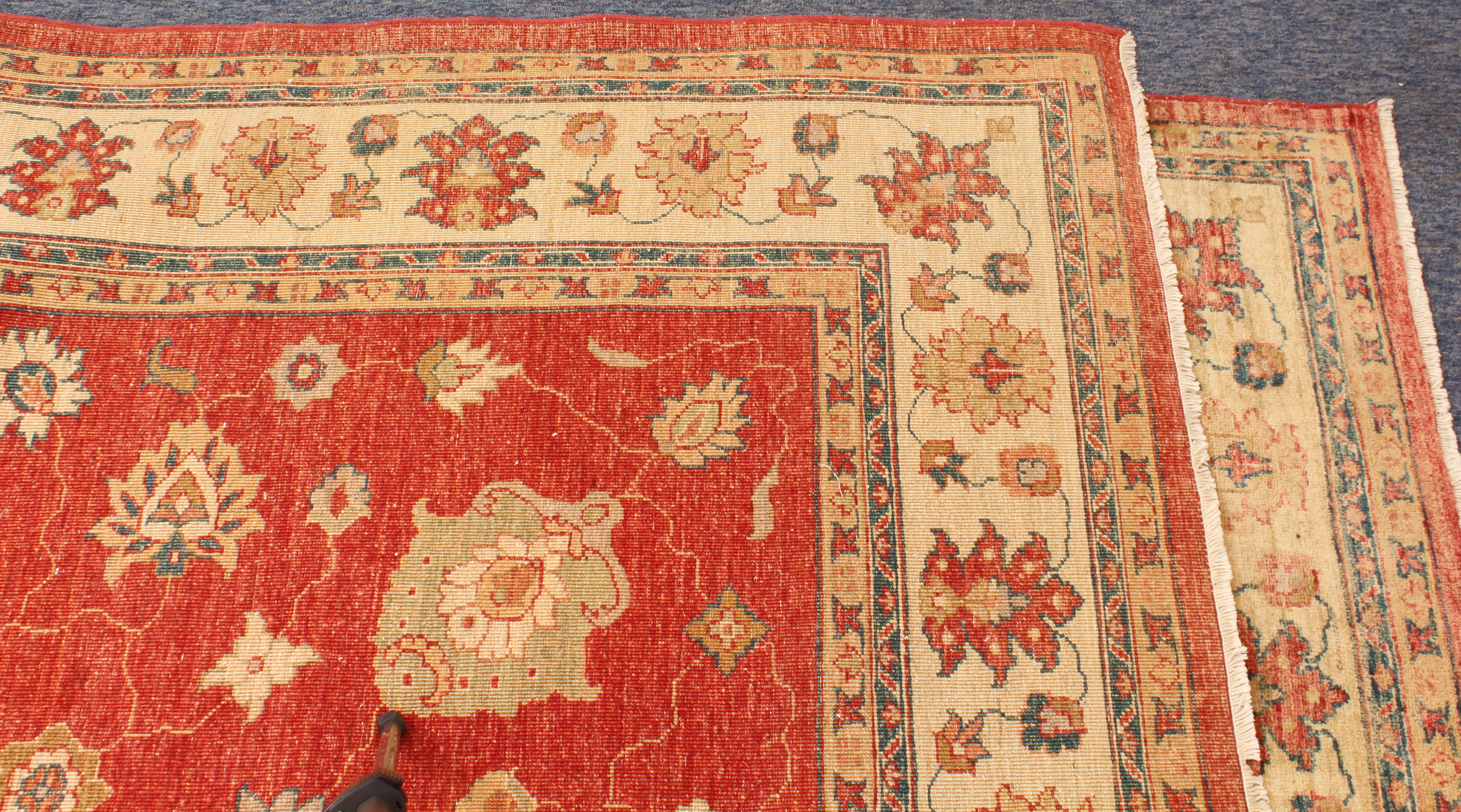 A hand knotted wool Afghan Ziegler rug - with typical all over floral decoration on a madder ground, - Image 5 of 5