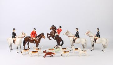 A collection of fourteen Beswick hunting figures - with impressed and black printed factory marks,