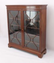 An Edwardian inlaid mahogany display cabinet or glazed bookcase - the satinwood banded top over a