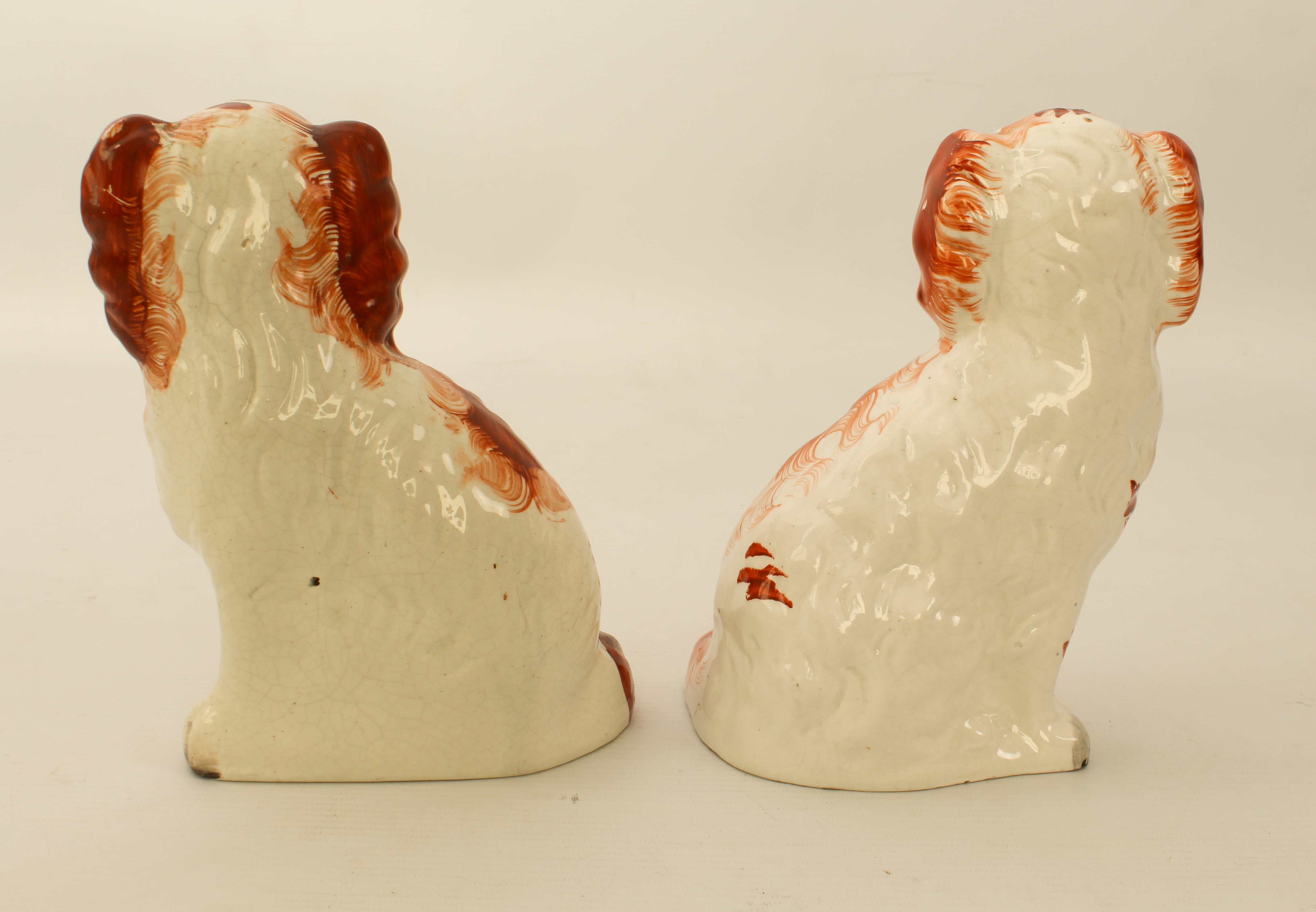 Two 19th century small Staffordshire pottery dogs - 19.2 cm high, one chipped to front paw. - Image 2 of 2