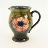 A Moorcroft jug in the 'Anemone' pattern - impressed factory mark with facsimile signature, also